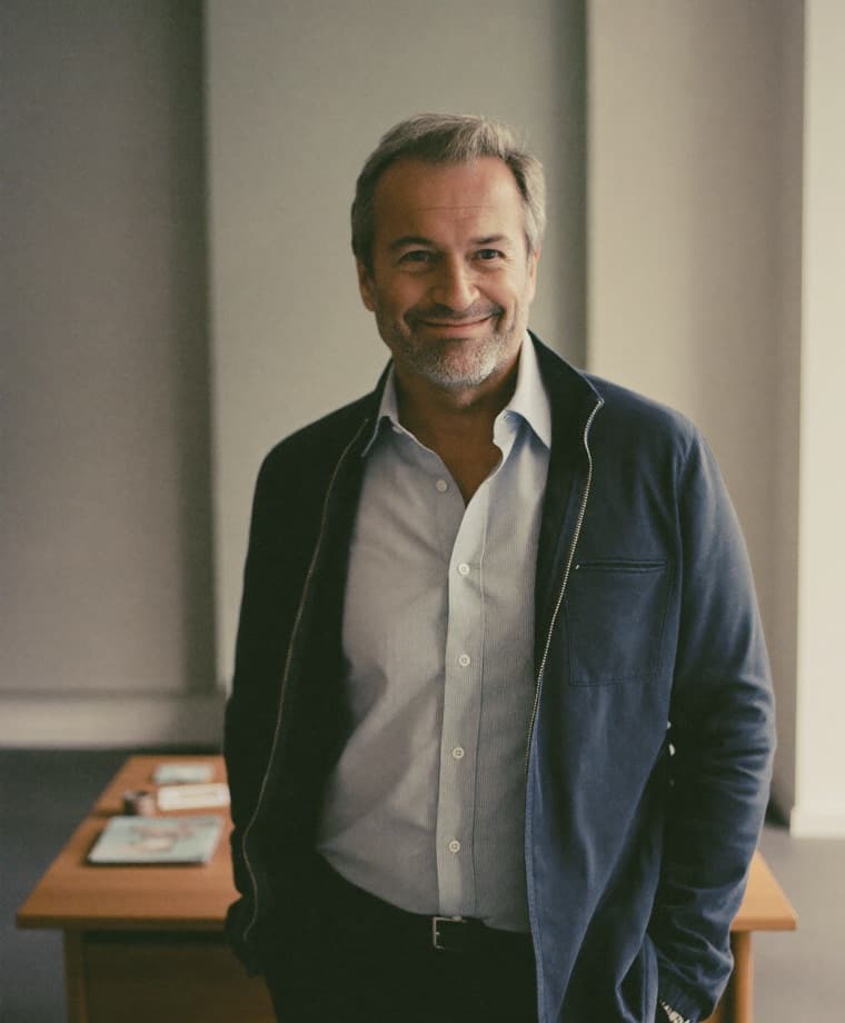 An independent financial adviser standing in a bright, quiet office
