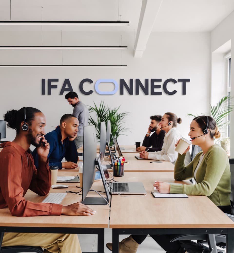 The IFA Connect team taking calls at their desks in the office